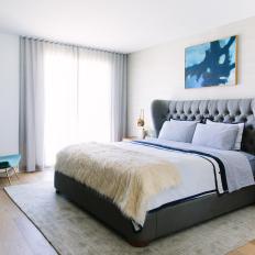 Eclectic Bedroom With Gray Upholstered Bed