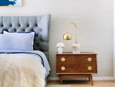 Gray Upholstered Headboard and Small Nightstand in Eclectic Bedroom