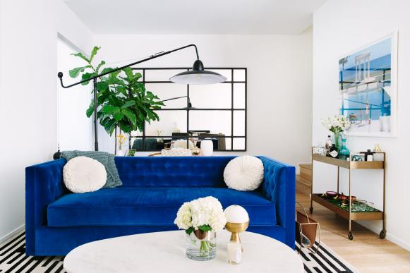 White Coffee Table and Blue Sofa in Eclectic Living Room