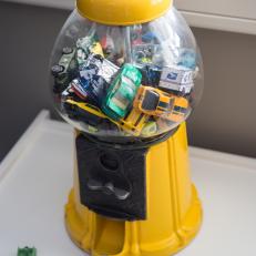 An Old Yellow Gumball Machine Gets Repurposed as Car Storage In A Big Boy's Bedroom