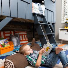 Camping In Style: Big Boy Room Features a Loft Bed and Log Pillow