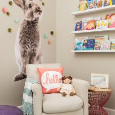Whimsical Nursery with Large Bunny Wall Decoration and Floating Book Shelves