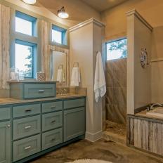 Country-Style Neutral Master Bathroom With Blue Vanity Cabinets