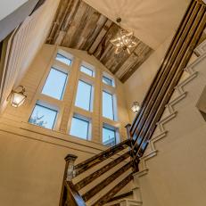 White Country-Style Staircase With Reclaimed Wood Pitched Ceiling