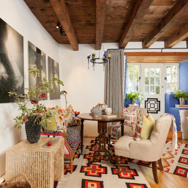 Multicolored Sitting Room With Exposed Beam Ceiling and Blue Foyer