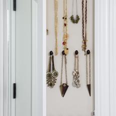 Jewelry Hanging on Wall Rack in Walk-In Closet