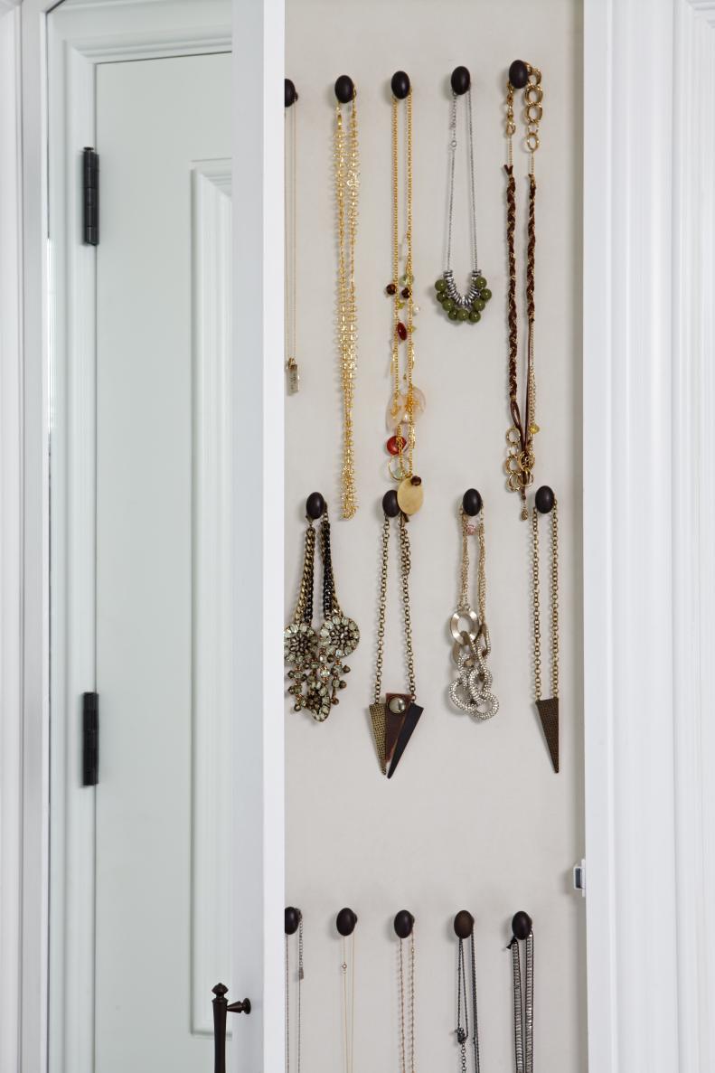 Necklaces Hanging on Wall in Walk-In Closet