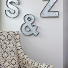 Print Armchair With Metal Letters on Wall 