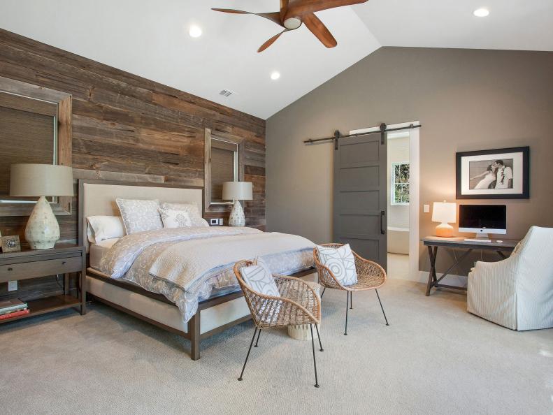 Covering one large wall with 100-year-old barnwood gave this master bedroom instant farmhouse appeal. Designers Leslie Calish and Gayle Leksan of LMK Interiors then furnished the space with a mix of transitional and contemporary pieces, creating a fresh, modern look. Combining disparate elements is the key to the room’s success. “The wood and the steel sliding-door hardware add that farmhouse flavor to an otherwise clean design,” they say. “The right mix keeps a space feeling current, not contrived.”