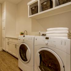 Organized Modern Laundry Room With Overhead Storage