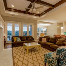 Colorful Open Plan Living Room With Exposed Beam Coffered Ceiling 
