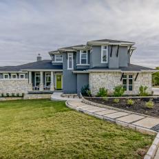 Gray-Blue Craftsman Home With Neutral Stone Walkway