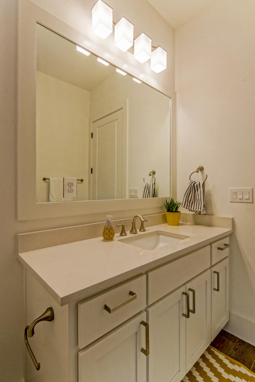 Modern White Bathroom With Large Vanity Mirror | HGTV
