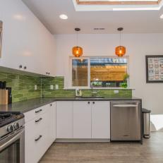 Contemporary Kitchen With Orange Hanging Lights