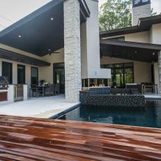 Contemporary Outdoor Kitchen Sits Poolside