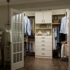 White Walk In Closet With Sailboat
