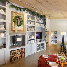 Festive French Country Living Room With Gray Built-In Bookshelves