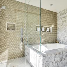 Large Modern Bathroom Featuring a Glass Shower and Jetted Tub With Patterned Tile Accent Wall 