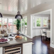 Spacious Transitional Living Space With Gunmetal Kitchen Pendant Lights, Neutral Color Scheme and Sunny, Natural Lighting 