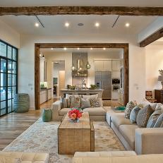 Neutral Contemporary Great Room With Rustic Ceiling Beams