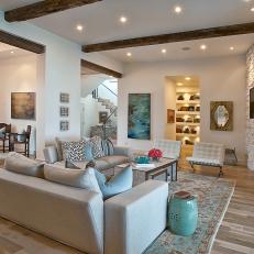Neutral Contemporary Great Room With Stacked Stone Fireplace Surround