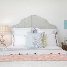 Pastel Coastal Bedroom With Gray Wood-Plank Headboard