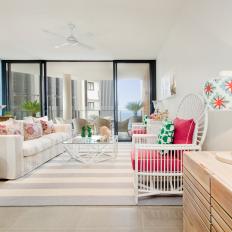 White Coastal Living Room With Hot-Pink Cushions