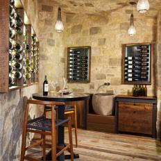 Spacious Wine Cellar With Rustic Stone Ceiling and Walls