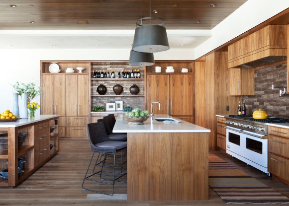 Neutral Kitchen With Two Islands and Medium Grain Wooden Cabinets