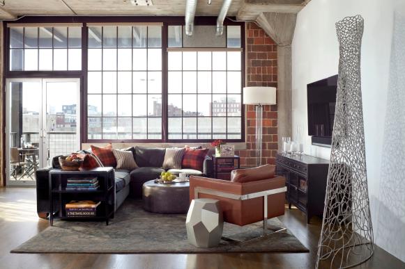 White Living Room With Exposed Brick Wall and City View