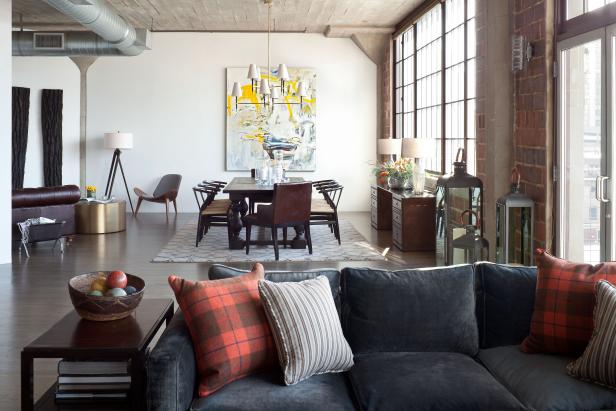 Living and Dining Rooms With Gray Sofa and Industrial Ceiling