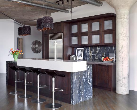 White Kitchen With Brown Cabinets and Gray Marble Countertops 