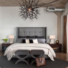 Modern Master Bedroom With Artistic Metal Light Fixture