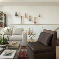 Modern Furniture and White Walls Highlight Collector's Items in Living Room