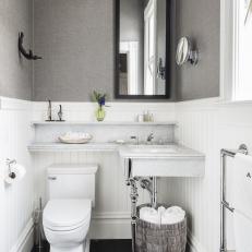 Country Bathroom With Gray Wallpaper, Sink Counter With Connected Shelving and Painted Black Wooden Floor