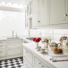 White Kitchen With Checkerboard Flooring