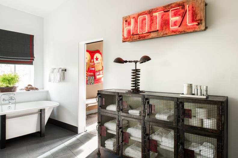 Bathroom With Neon Hotel Sign