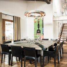 Eclectic Dining Room With Black Chairs