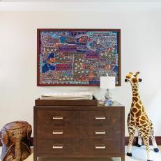 Contemporary Neutral Nursery With Dark Wood Changing Table