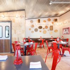 Industrial Rustic Restaurant Dining Room With Red Metal Chairs