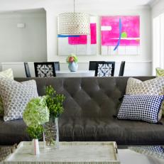 Eclectic White Living And Dining Room With Black Chesterfield