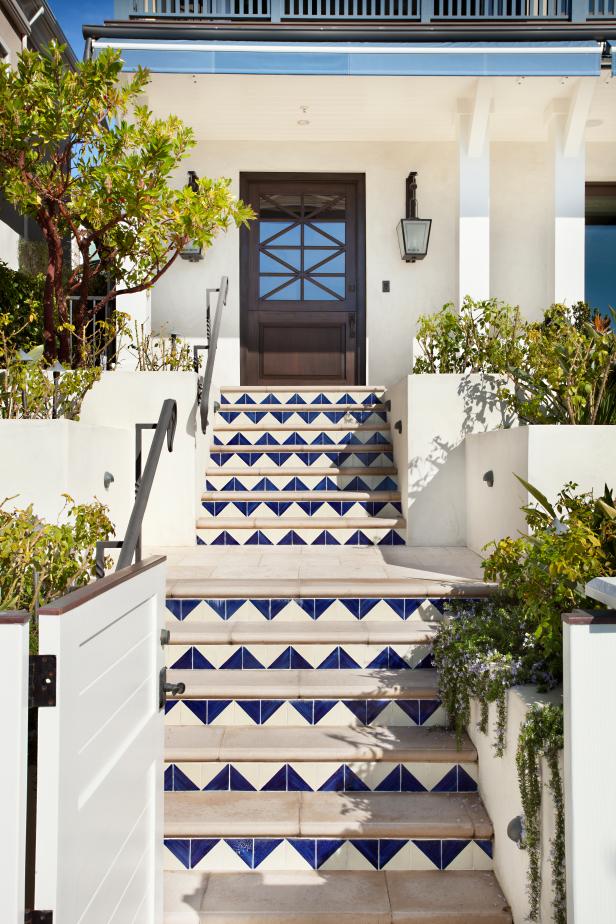 Entryway With Tiled Stairs and Dutch Door