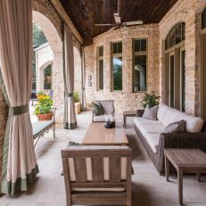 Transitional Stacked Stone Porch With Wood Plank Ceiling