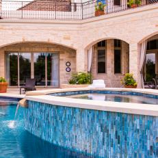 Mediterranean Style Swimming Pool With Hot Tub