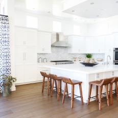 White Eat-In Kitchen With Modern Wooden Barstools