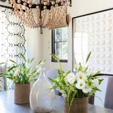 Neutral Spanish Coastal Dining Room With Beaded Chandelier