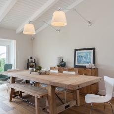 White Coastal Dining Room With Wood Table