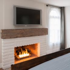 White Brick Fireplace With Rustic Mantel