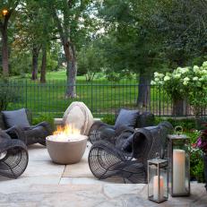 Contemporary Stone Patio With Black Chairs