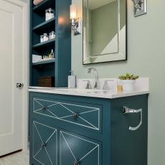 Freestanding Navy Blue Vanity and Shelving in Elegant Bathroom